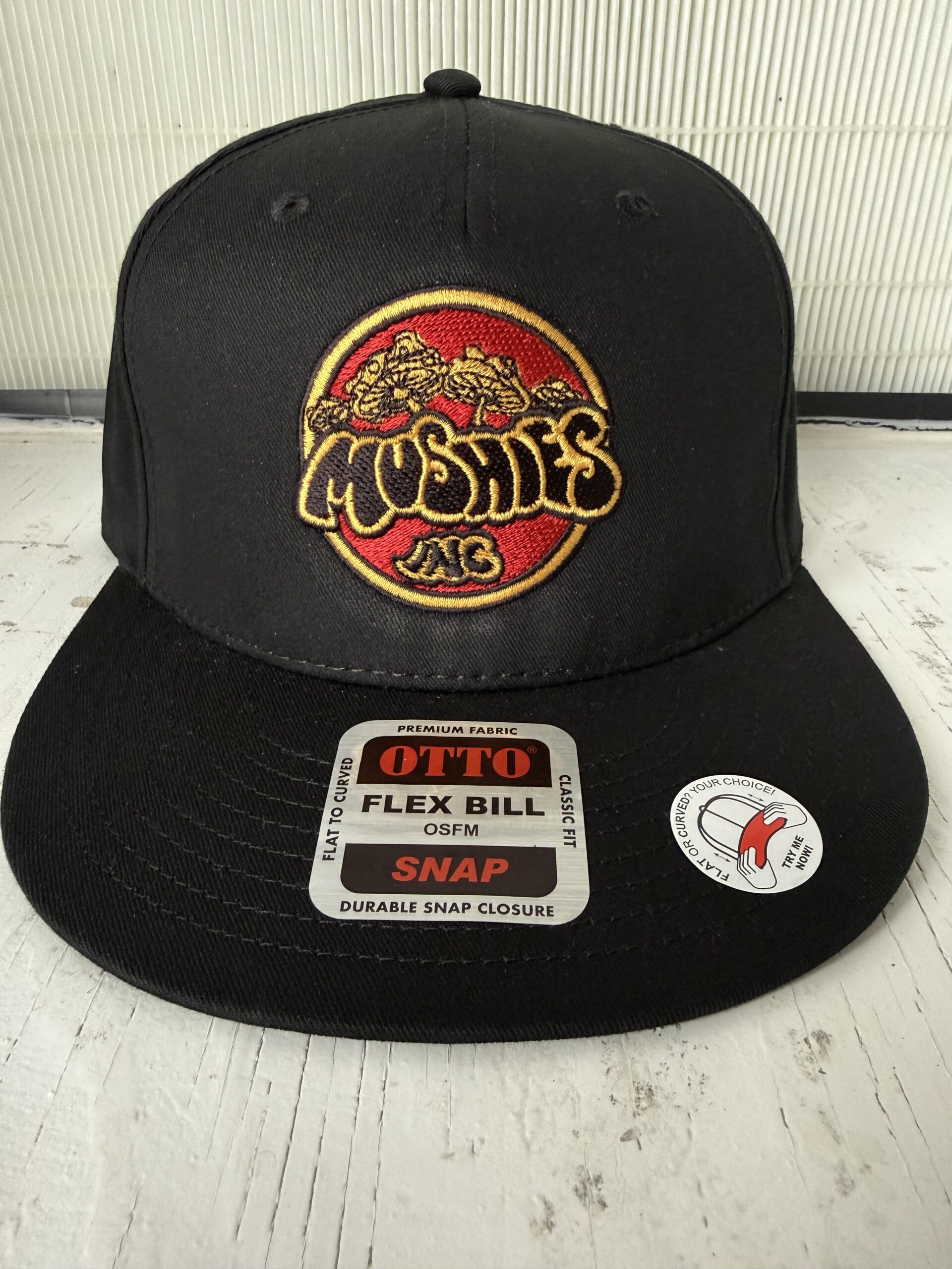 Embroidered Black Mushies Inc Circle Logo Snap Back Hat